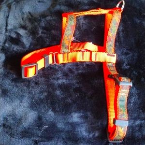 Camouflage and neon orange harness